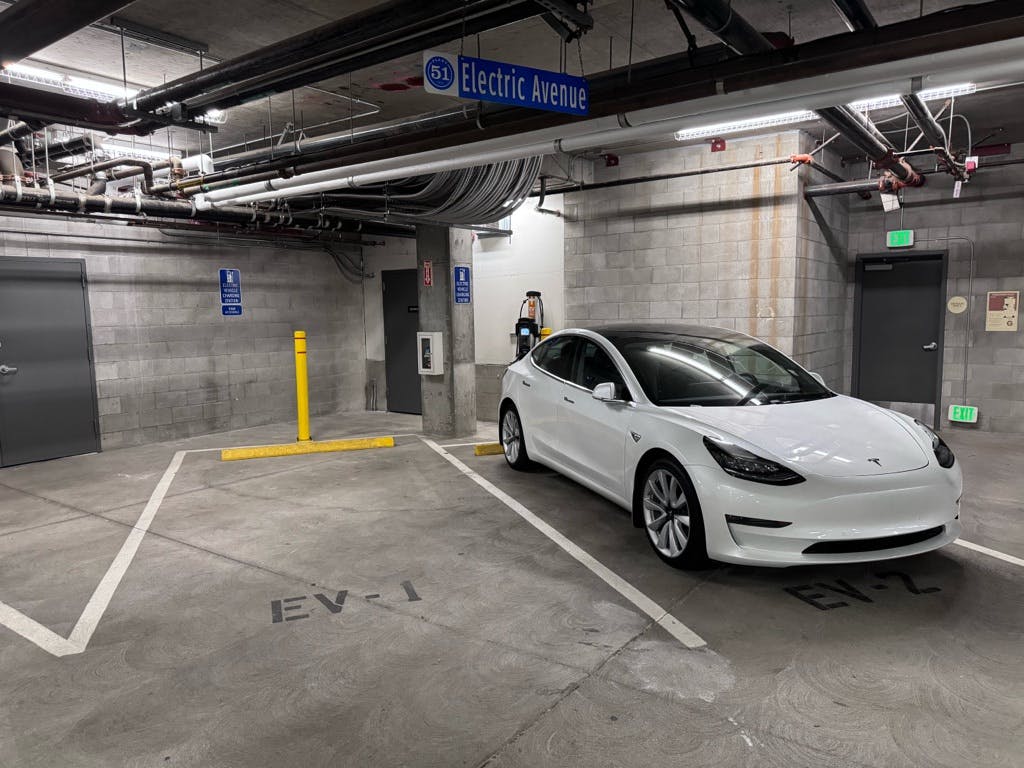 A photo of an electric Tesla charging at Plant 51
